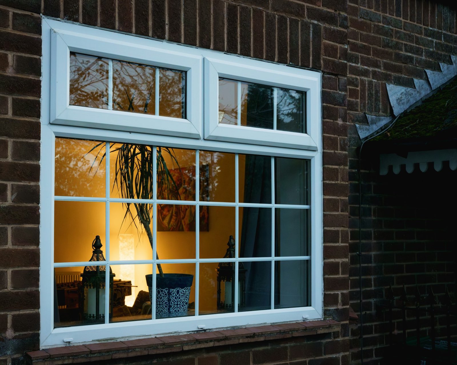 White uPVC double glazed window in a brick wall